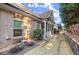 Home exterior featuring a brick facade, covered porch, and lovely yard at 2797 Middlecreek Way, Cumming, GA 30041