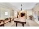 Game room featuring a billiards table, comfortable seating, and large windows for ample natural light at 2797 Middlecreek Way, Cumming, GA 30041