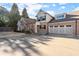 Attractive home featuring a spacious three-car garage with ample driveway at 2797 Middlecreek Way, Cumming, GA 30041