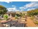 Landscaped garden with raised planters and a charming garden shed at 2797 Middlecreek Way, Cumming, GA 30041