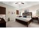 Inviting main bedroom with neutral tones, tray ceilings, carpet, and stylish decor for a relaxing ambiance at 2797 Middlecreek Way, Cumming, GA 30041
