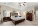 Spacious main bedroom with tray ceilings, carpet, and traditional furnishings, creating a comfortable retreat at 2797 Middlecreek Way, Cumming, GA 30041