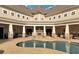 Outdoor community pool with comfortable seating area by the stone fireplace, perfect for entertaining guests at 2797 Middlecreek Way, Cumming, GA 30041