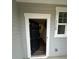 View of the welcoming entryway with a modern door and visible interior hallway at 3558 Eagle Court, Fulton, GA 30331