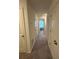 Well-lit hallway with carpet, showcasing access to multiple rooms with white doors at 3558 Eagle Court, Fulton, GA 30331