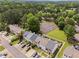 Aerial view of the community featuring well-maintained townhomes and community tennis court at 4971 Jenny Dr, Acworth, GA 30101