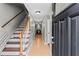 Bright foyer with staircase leading to the upper level and views of the living area at 4971 Jenny Dr, Acworth, GA 30101