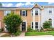 Inviting townhome featuring a well-manicured lawn and mature landscaping at 4971 Jenny Dr, Acworth, GA 30101