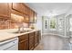 Kitchen featuring warm wood cabinets, tile backsplash and eating nook with bay window at 4971 Jenny Dr, Acworth, GA 30101