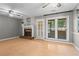 Well-lit living room with fireplace and access to the outdoor area at 4971 Jenny Dr, Acworth, GA 30101