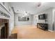 Bright and airy living room featuring a fireplace and large windows at 4971 Jenny Dr, Acworth, GA 30101