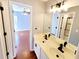 Bathroom featuring a double sink vanity with modern fixtures and a walk-in shower at 505 Tilbury Dr, Suwanee, GA 30024