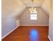 Lofted bedroom with hardwood floors, chandelier and a dormer window at 505 Tilbury Dr, Suwanee, GA 30024