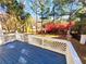 Inviting outdoor blue painted deck space with white railing overlooking lush greenery at 505 Tilbury Dr, Suwanee, GA 30024