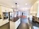 Spacious kitchen featuring stainless steel appliances, granite countertops, and an island with seating at 505 Tilbury Dr, Suwanee, GA 30024