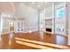 Elegant living room featuring hardwood floors, fireplace, and bright light at 505 Tilbury Dr, Suwanee, GA 30024