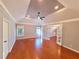 Spacious main bedroom with hardwood floors, tray ceiling, and lots of natural light at 505 Tilbury Dr, Suwanee, GA 30024