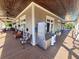 Wide angle view of covered outdoor patio with seating and an ice machine at 505 Tilbury Dr, Suwanee, GA 30024