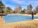 Community sport court includes tennis, basketball, and playground near a landscaped house at 505 Tilbury Dr, Suwanee, GA 30024