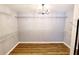 Spacious walk-in closet with custom shelving and ample storage space at 505 Tilbury Dr, Suwanee, GA 30024