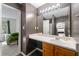 Well-lit bathroom with a large mirror, modern vanity, and a view into an adjacent bedroom at 6901 Gallant Se Cir # 13, Mableton, GA 30126