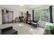 Bright, carpeted room with lots of natural light from large windows and comfortable sitting area and desk at 6901 Gallant Se Cir # 13, Mableton, GA 30126
