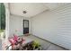Inviting front porch with potted plants leading to a charming front door and light grey exterior at 6901 Gallant Se Cir # 13, Mableton, GA 30126