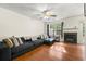 Cozy living room with hardwood floors, fireplace, large window, and comfortable seating at 6901 Gallant Se Cir # 13, Mableton, GA 30126