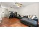 Cozy living room with hardwood floors, a plush sofa, and a ceiling fan for added comfort at 6901 Gallant Se Cir # 13, Mableton, GA 30126