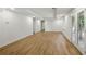 Finished basement with recessed lights and wood laminated flooring at 12230 Asbury Park Dr, Roswell, GA 30075