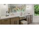 Elegant bathroom with dual vanities, marble countertops, and sophisticated cabinetry, offering ample space at 12230 Asbury Park Dr, Roswell, GA 30075