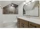 Updated bathroom with decorative tile, modern fixtures, and vanity at 12230 Asbury Park Dr, Roswell, GA 30075