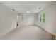 Large bedroom with ample closet space, carpet, and windows at 12230 Asbury Park Dr, Roswell, GA 30075