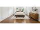 Inviting bedroom with hardwood floors, natural light, and classic moldings adding character to the room at 12230 Asbury Park Dr, Roswell, GA 30075