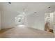 Spacious carpeted bedroom with natural light and a ceiling fan at 12230 Asbury Park Dr, Roswell, GA 30075
