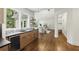 Bright kitchen with a window view to the backyard, wood floors, and stainless appliances at 12230 Asbury Park Dr, Roswell, GA 30075