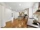 Open kitchen with bright wood floors, lots of cabinets, and stainless steel appliances at 12230 Asbury Park Dr, Roswell, GA 30075