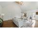 Living room with bright white walls and floors, cathedral ceiling and lots of natural light at 12230 Asbury Park Dr, Roswell, GA 30075
