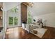 Spacious living room with a stone fireplace, cathedral ceiling, and lots of natural light at 12230 Asbury Park Dr, Roswell, GA 30075