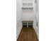 Bright mudroom with a built-in bench, coat hooks, and overhead storage, perfect for organization at 12230 Asbury Park Dr, Roswell, GA 30075