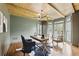 Inviting office space with wood ceiling beams, modern lighting, and large windows at 12230 Asbury Park Dr, Roswell, GA 30075
