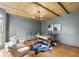 Stylish office with wood beam ceiling, hardwood floors, and ample natural light at 12230 Asbury Park Dr, Roswell, GA 30075