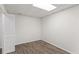 Finished basement room with neutral walls and vinyl floors, perfect for entertaining at 129 Crown Walk, Mcdonough, GA 30253