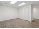 Finished basement room with neutral walls and vinyl floors, perfect for entertaining at 129 Crown Walk, Mcdonough, GA 30253