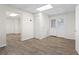 Finished basement area with new flooring, white trim and door that leads to the backyard at 129 Crown Walk, Mcdonough, GA 30253
