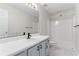 Bathroom with double vanity, white countertops, shower and tub at 129 Crown Walk, Mcdonough, GA 30253