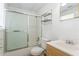 Clean bathroom features a shower/tub combination with sliding door and vanity at 129 Crown Walk, Mcdonough, GA 30253