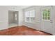 Bright dining area featuring a large window, neutral paint, and terracotta tile flooring at 129 Crown Walk, Mcdonough, GA 30253