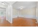 Formal dining room featuring hardwood floors, elegant lighting, and wainscoting at 129 Crown Walk, Mcdonough, GA 30253