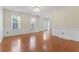 Formal dining room featuring hardwood floors, elegant lighting, and wainscoting at 129 Crown Walk, Mcdonough, GA 30253